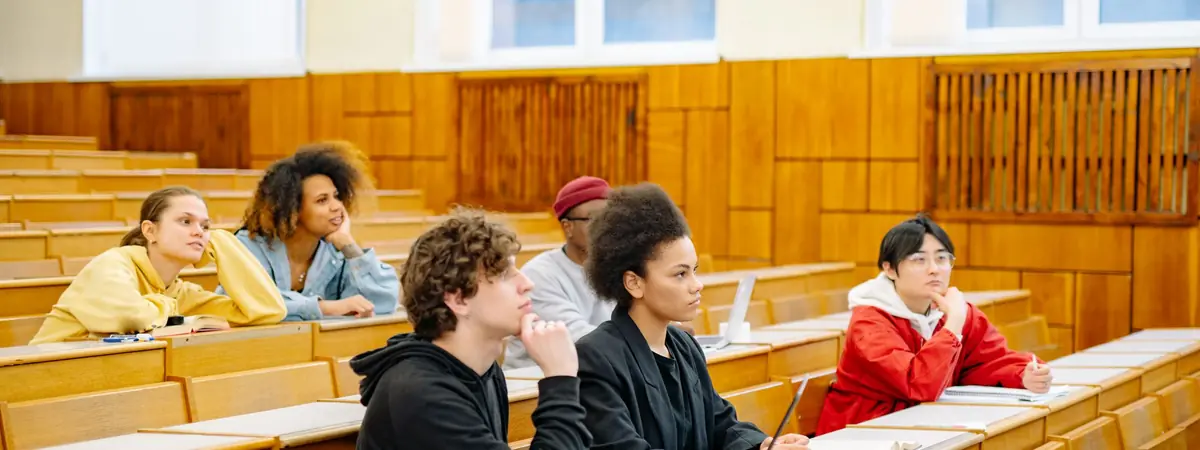Students listen in a university lecture hall, the classes behind a criminal justice major.